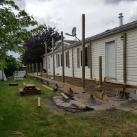 Doucette-Exteriors-White-Court-Alberta-Deck-Contractors-in-the-yard