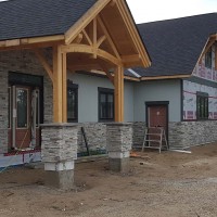 Doucette-Exteriors-White-Court-Alberta-framing-and-stone-accent-siding